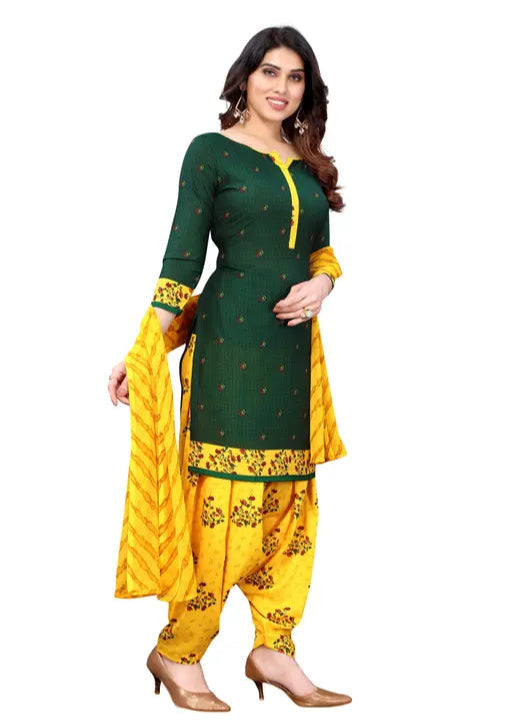 Woman wearing a green and yellow traditional outfit with a white background