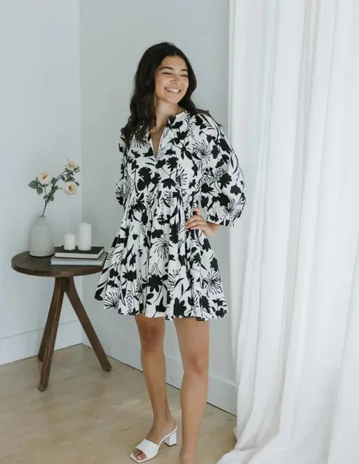Sufiyana Ámour's White Rayon Fit and Flare Dress with Black Floral Patterns
