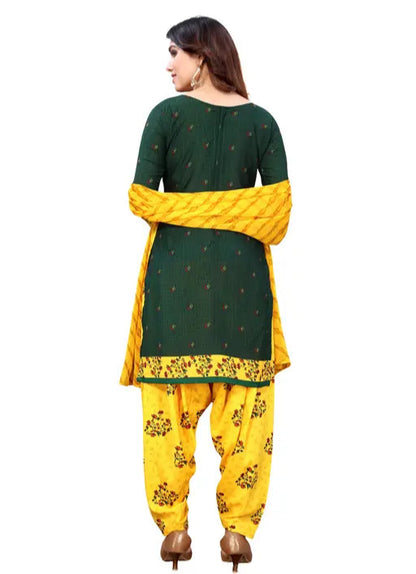 Woman wearing a green and yellow traditional outfit on a white background