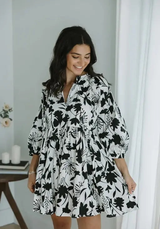 Sufiyana Ámour's White Rayon Fit and Flare Dress with Black Floral Patterns