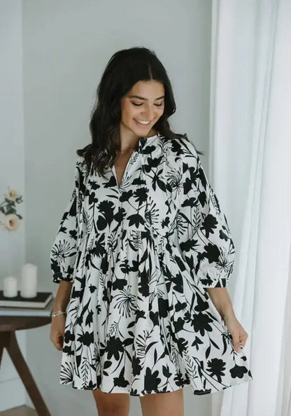 Sufiyana Ámour's White Rayon Fit and Flare Dress with Black Floral Patterns
