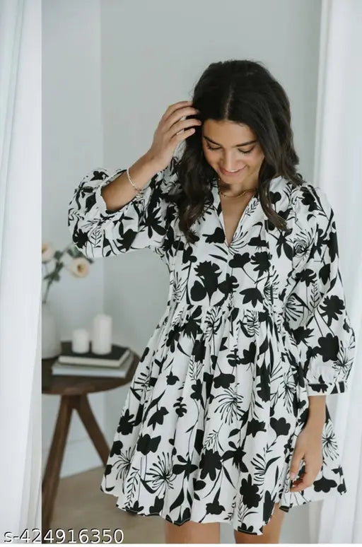 Sufiyana Ámour's White Rayon Fit and Flare Dress with Black Floral Patterns